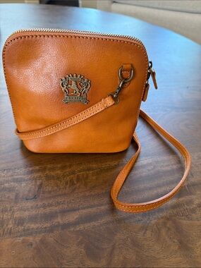 Tan Leather Crossbody Pratesi Bag with Crest Emblem